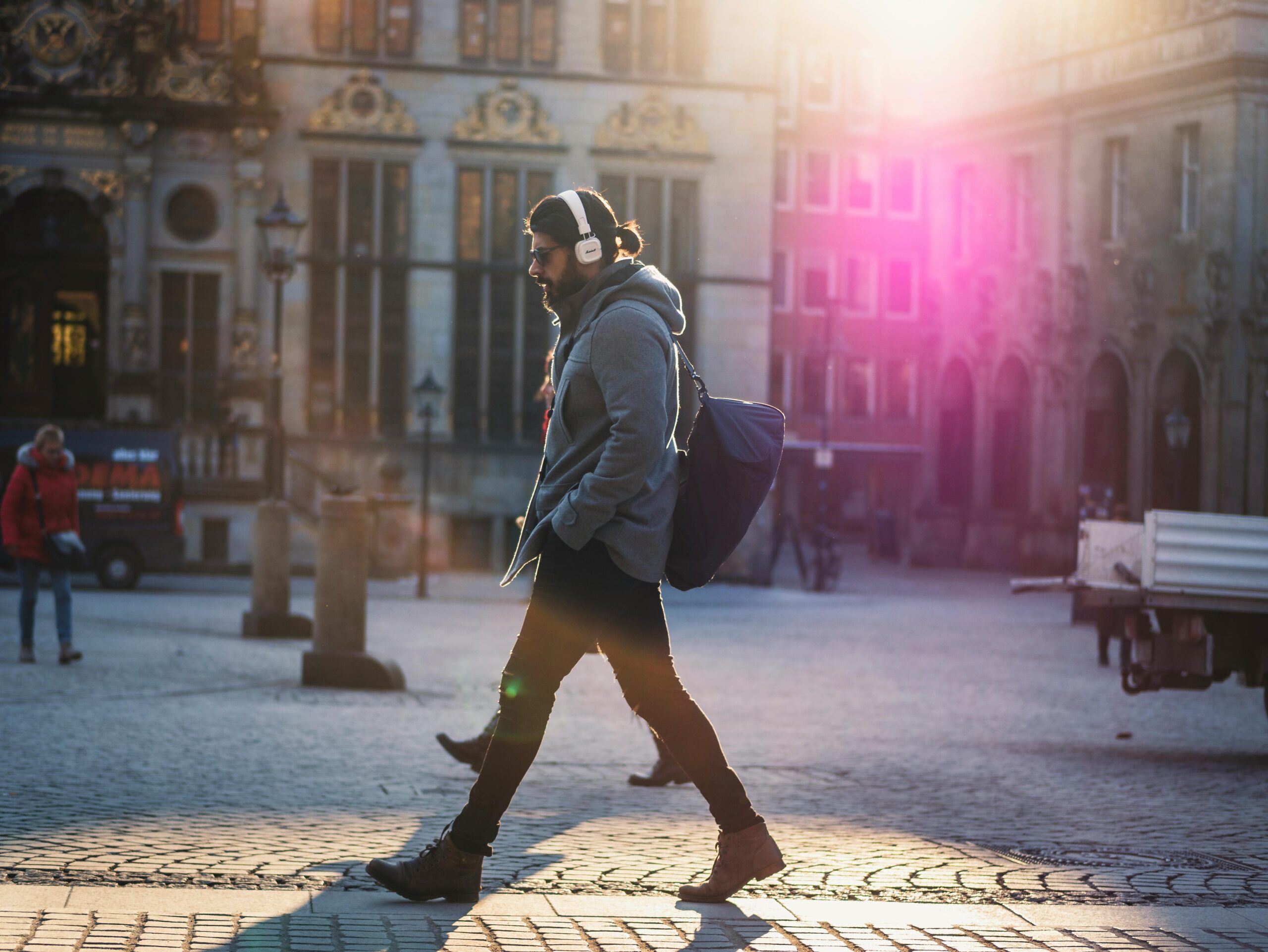 A person walking on the street to his after the work 